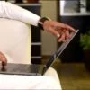 Arabic man working on laptop and mobile