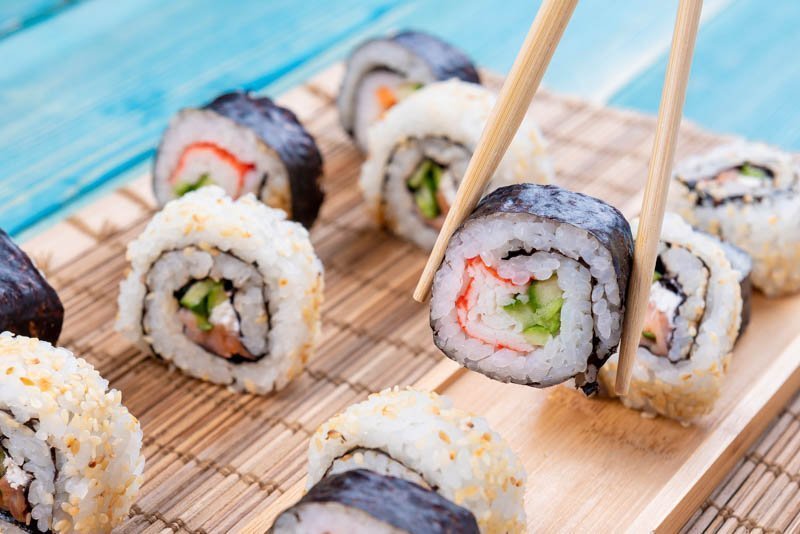 Sushi Rolls with Salmon, Rice and Cucumber – Blue Wood – Photo 1