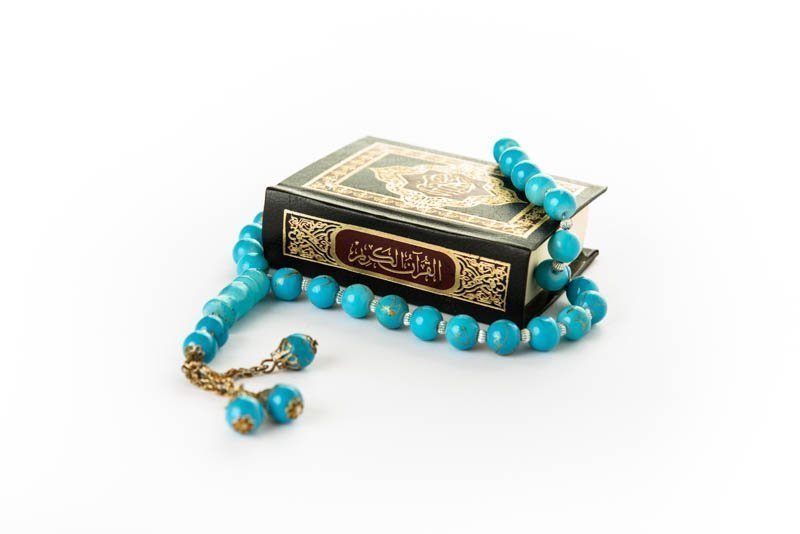 Quran with Rosary - holy book of Muslims - Koran - quran white background