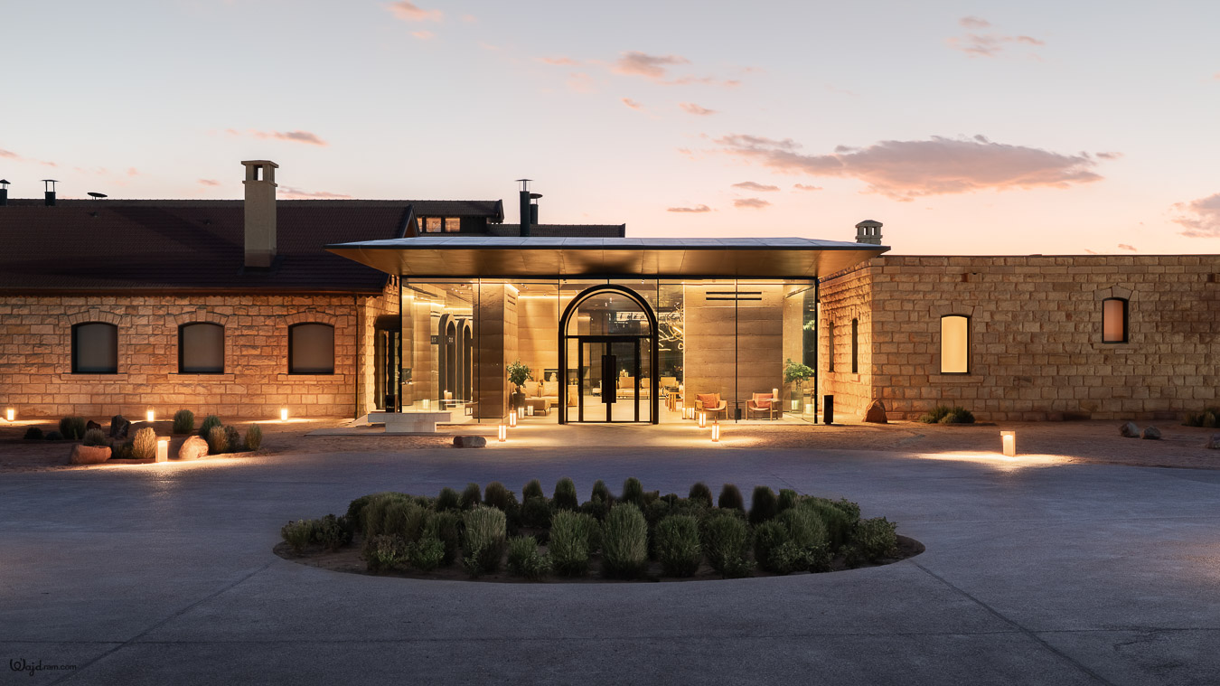 The Chedi Hegra luxury hotel exterior at AlUla, Saudi Arabia. Heritage railway station architecture repurposed into a five-star hospitality property within the UNESCO World Heritage Site of Hegra (Mada'in Salih). Hotel architecture photography by Wajd Ramadan