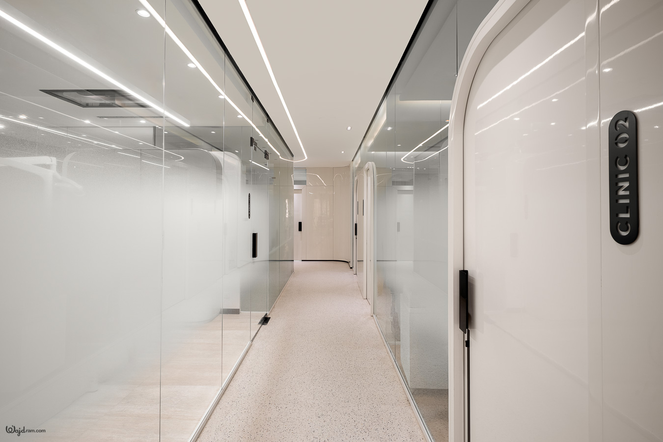 Built-in cabinetry and illuminated display shelving in the La Clinica interior — interior architecture photography by Wajd Ramadan, Hittin, Riyadh.